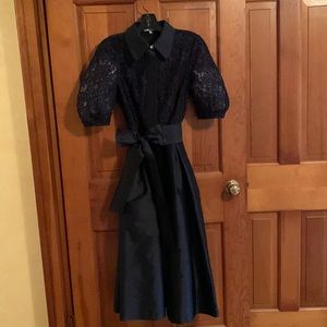 Classically elegant mother of the bride cocktail length dress.